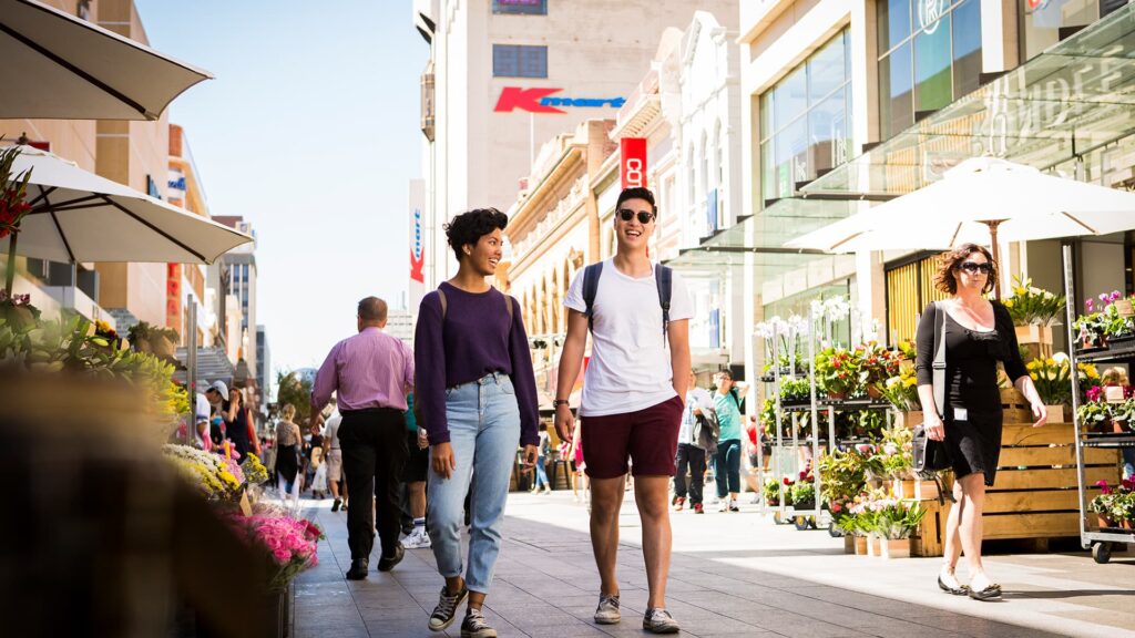 students walking in a busy street