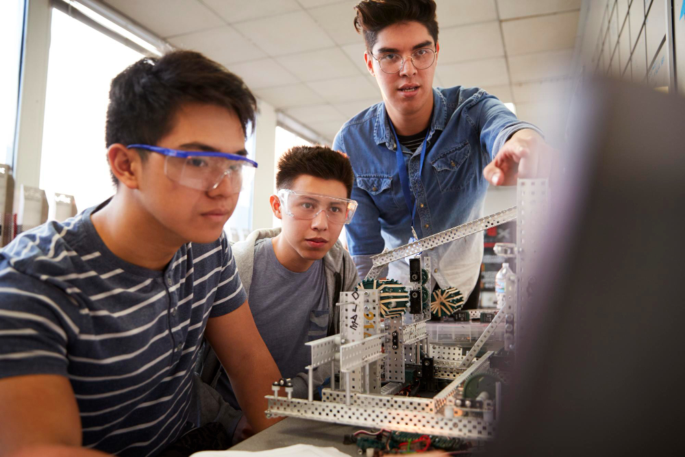 Engineering students doing hands-on work in a lab behind UC’s electrical engineering courses and other branches
