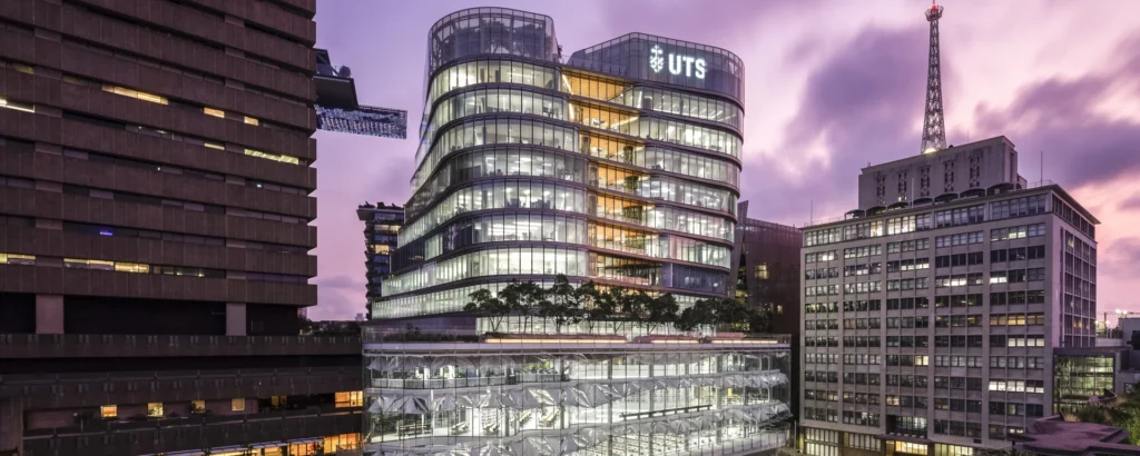 UTS Sydney Central Building with UTS signage at dawn